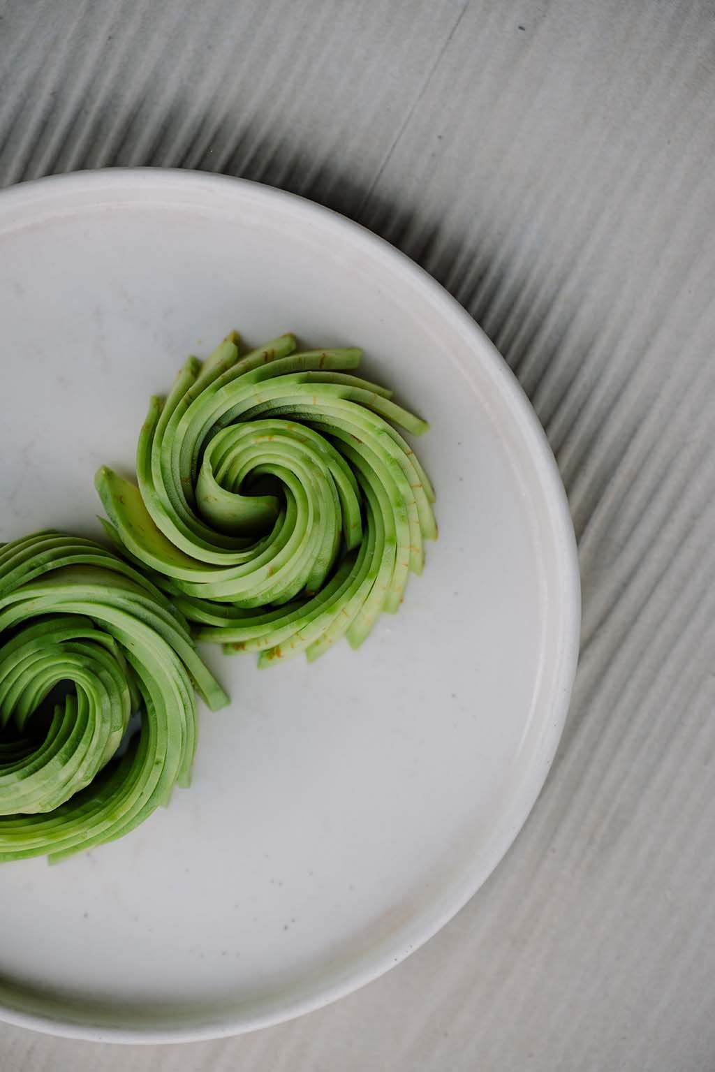 Whole and sliced avocado