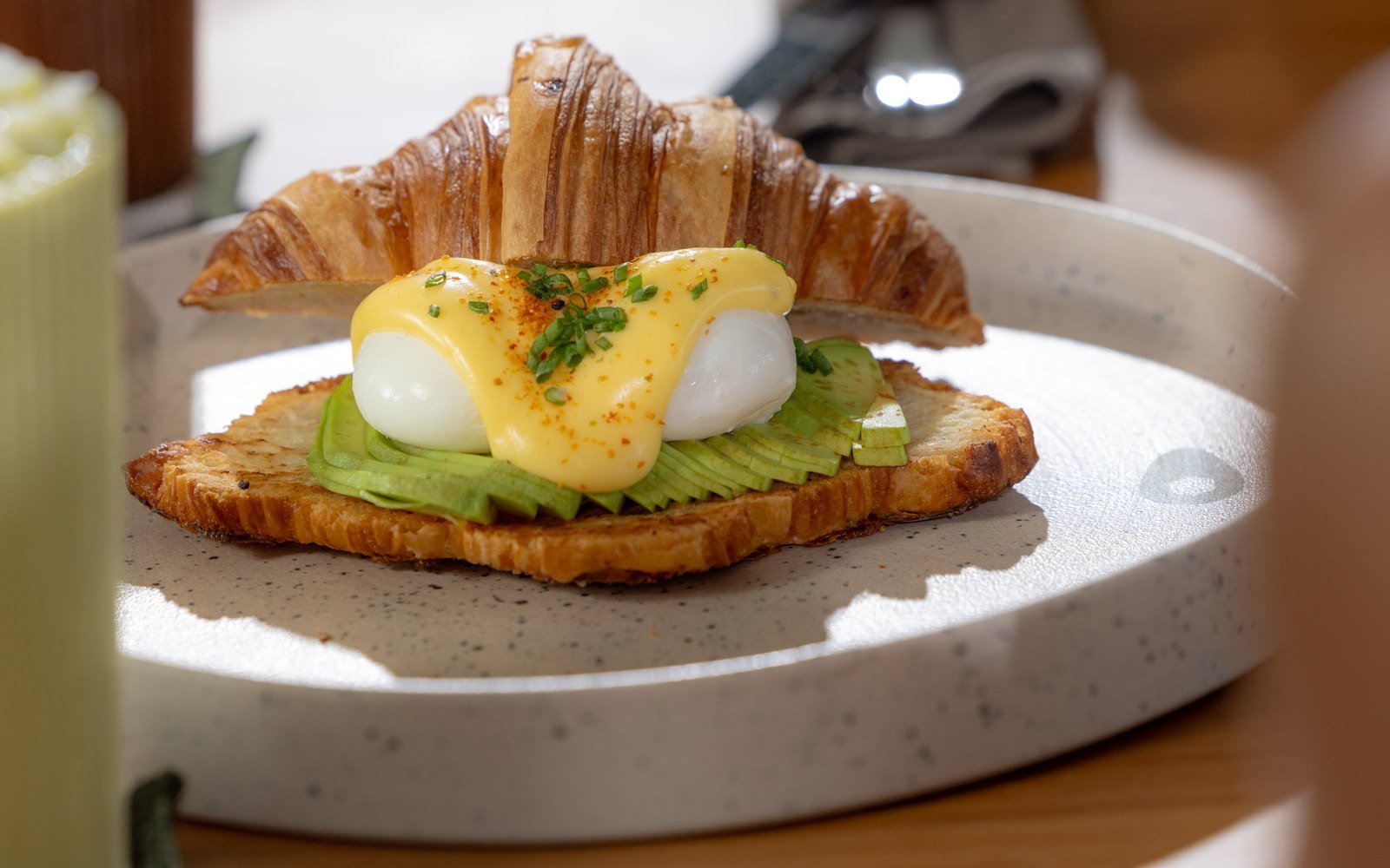 Avocado breakfast toast with egg and croissant at The Avocado Factory