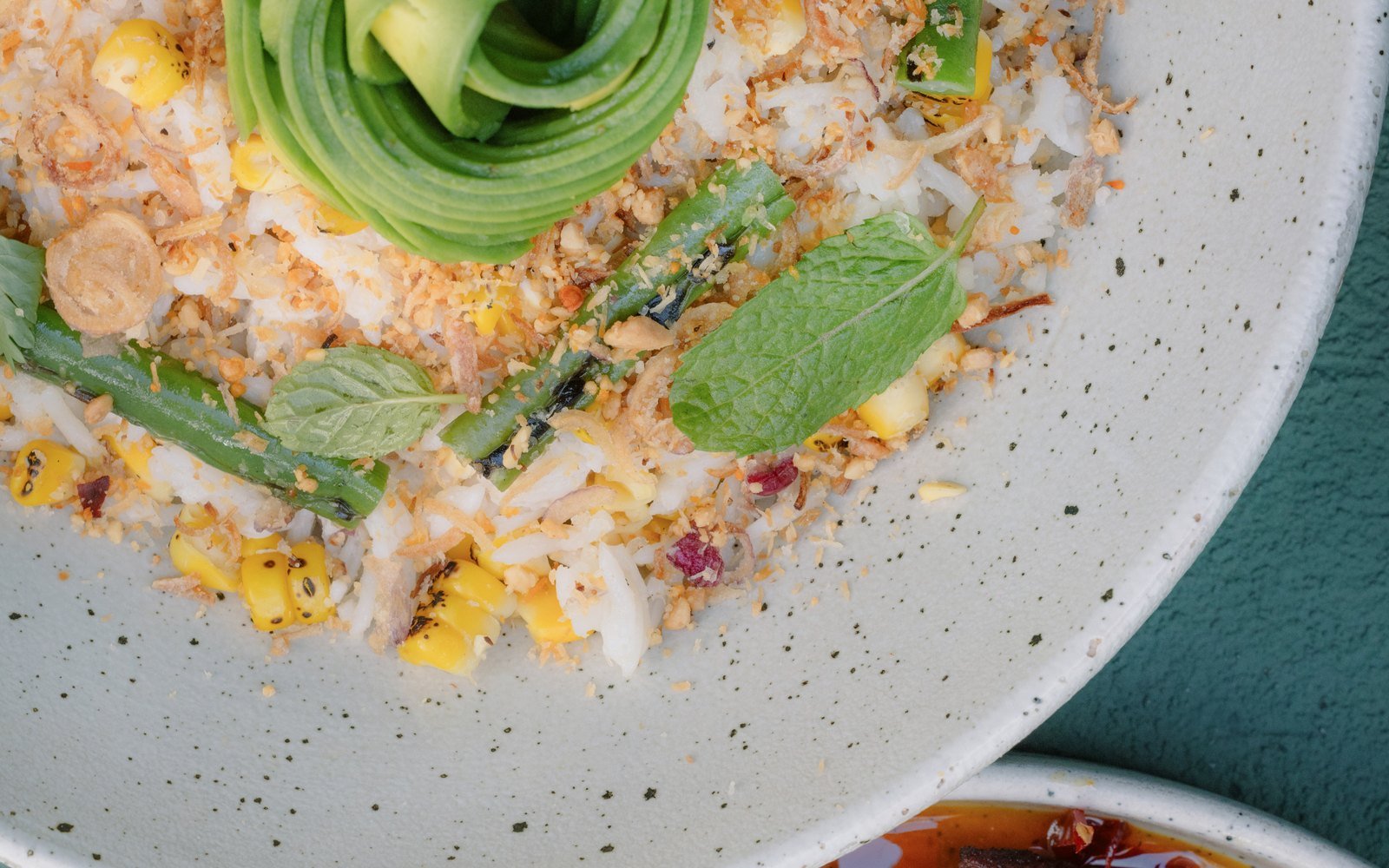 Coconut rice bowl with avocado and warm dinner dish at The Avocado Factory