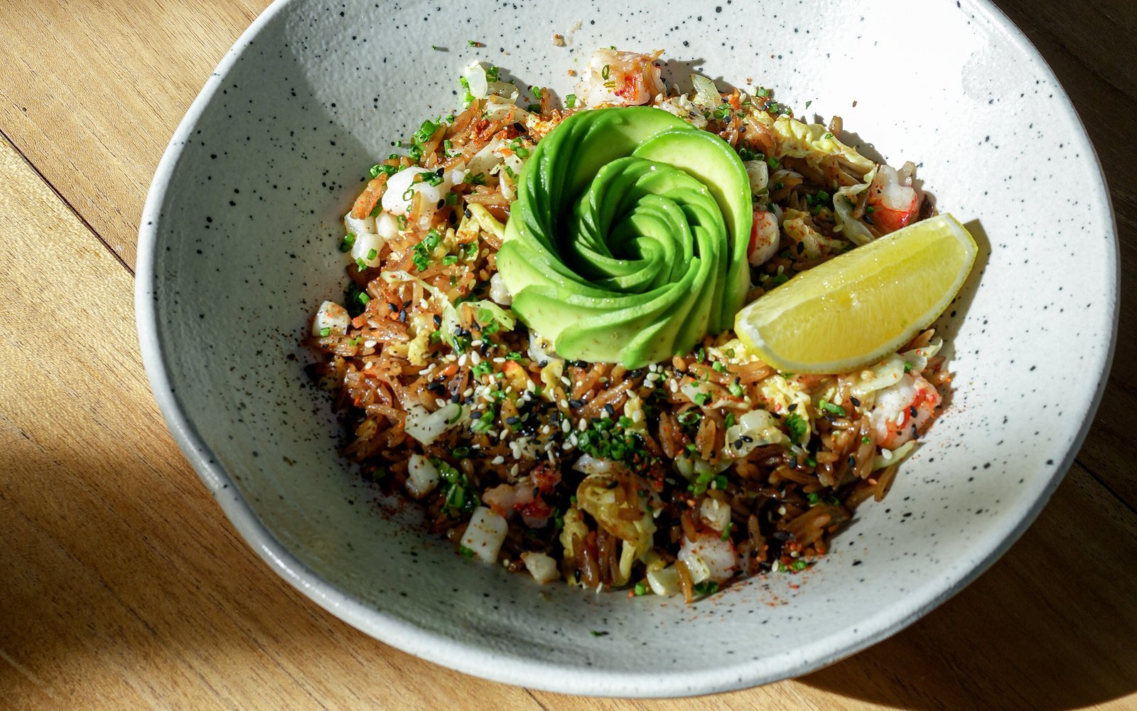 Avocado rice bowl with sliced avocado and lemon at The Avocado Factory