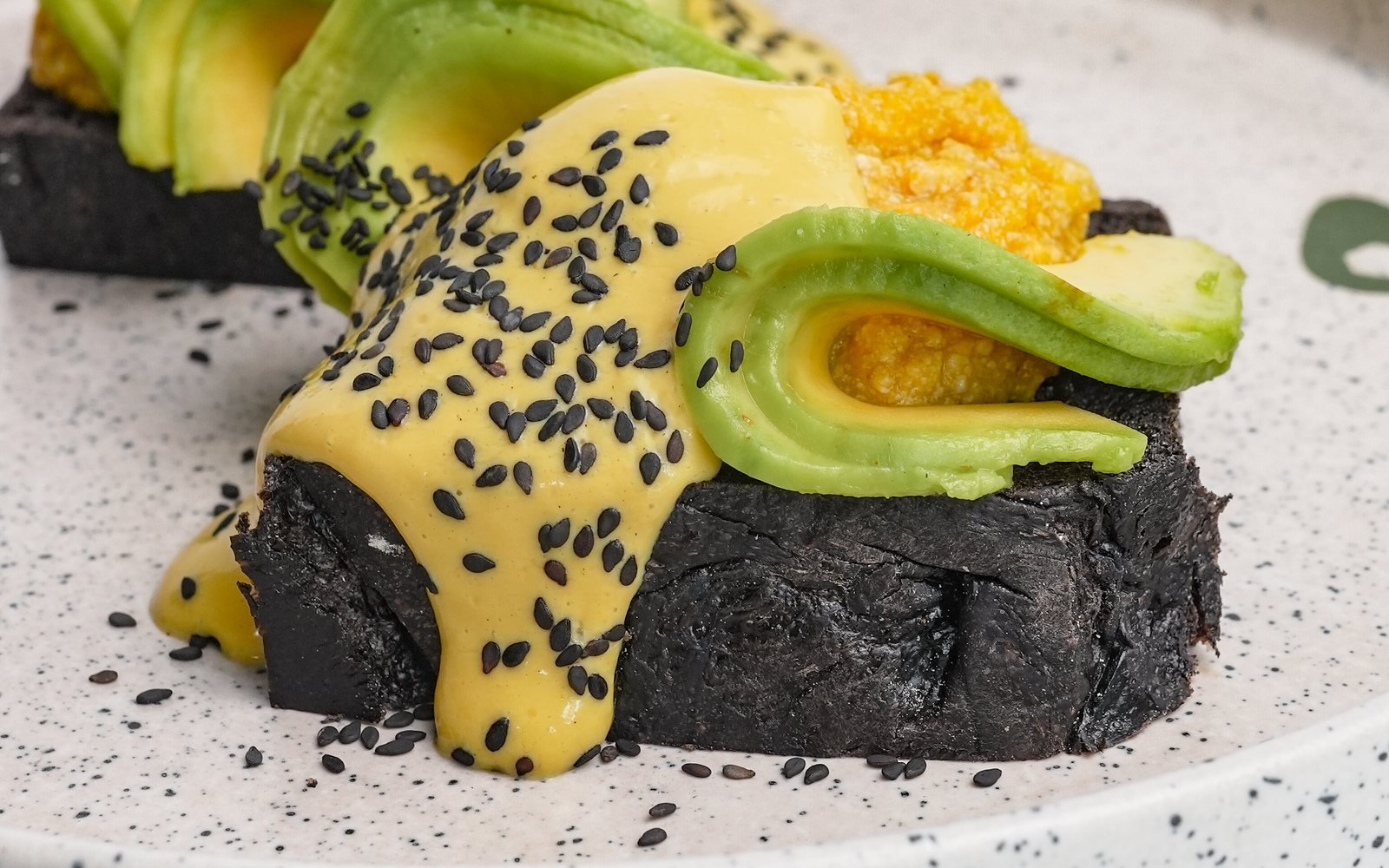 Avocado toast with vegan benedict sauce at The Avocado Factory