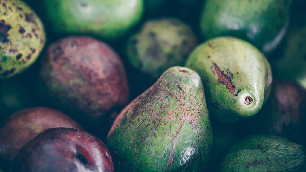 Fresh whole avocados, close up